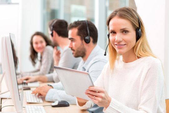 Young attractive woman working in a call center