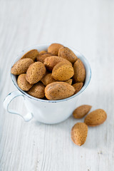 almonds on wooden surface