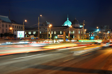 Fototapeta na wymiar Bucharest, Romania - October 18, 2012 - Night traffic on Bratianu Boulevard in Bucharest, Romania.