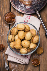 biscuits with condensed milk in a transparent plate, top view