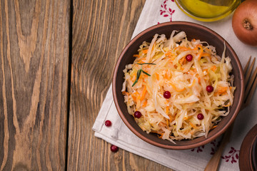 Ceramic bowl of sauerkraut with cranberry and space for text