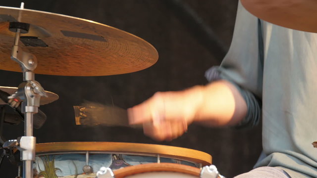 A unique drumsticks with metal strips on the tip. The strips give more noisy music from the drums during the concert