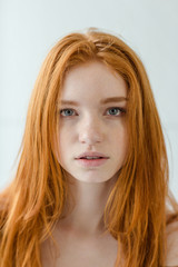 Redhead woman looking at camera
