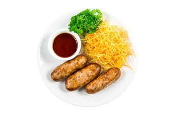 Grilled sausage with garnish and sauce on the plate