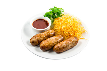 Grilled sausage with garnish and sauce on the plate