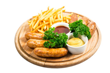 Grilled sausage with French fries and sauce on hot barbecue dish