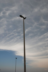 Fototapeta na wymiar Street Lamps and Mammatus Clouds 