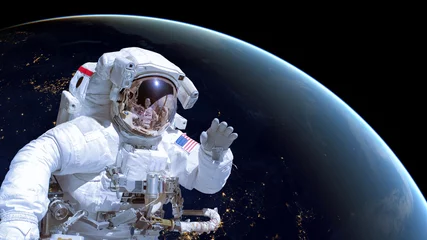 Poster Close up van een astronaut in de ruimte, aarde & 39 s nachts op de achtergrond. Elementen van deze afbeelding zijn geleverd door NASA © Delphotostock
