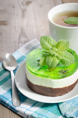 herbal tea with cake on wooden background.