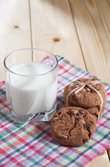 Glass with milk and cookies