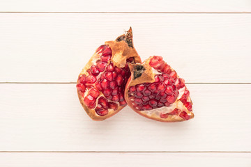 Pomegranates over grunge wooden background