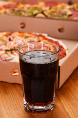Glass of coke and pizza