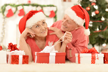 Fototapeta na wymiar Amusing old couple at Christmas