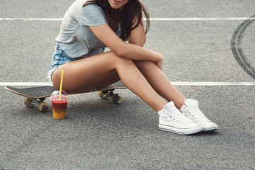 Skateboard, sexy legs and smoothie drink © blackday