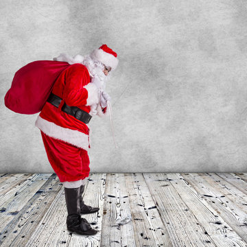 Santa Claus posing  on wooden background