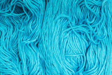 Closeup pile of blue yarn texture background
