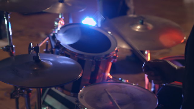 Black drum kit with powerful speaker in background