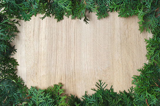 White cedar border frame on light oak wood horizontal background texture
