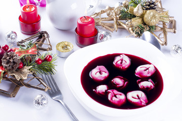 Fototapeta na wymiar Red borsch with uszka, traditional Christmas Eve dish