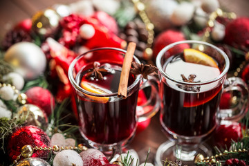 Christmas hot mulled wine with spices on a wooden table. The idea for creating greeting cards