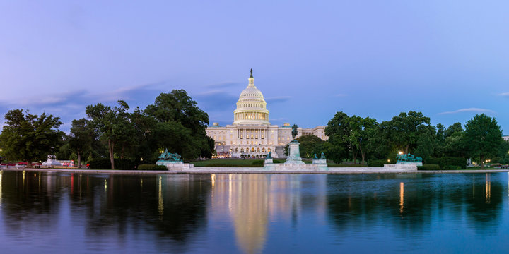 Panorama of the United Statues Capitol, seen from the the Capitol Reflecting Pool, Washington DC, USA.