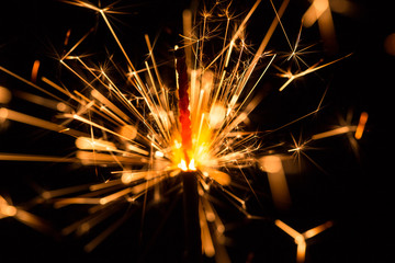 Christmas and New Year party sparkler on black