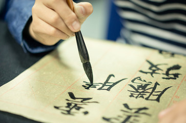 Chinese children learn to write Chinese characters, calligraphy is the traditional culture of China