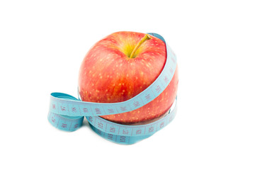 Red apple wrapped in measuring tape