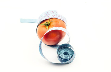 Tomato with measuring tape - a symbol of fitness