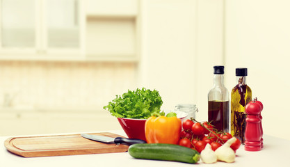 vegetables, spices and kitchenware on table