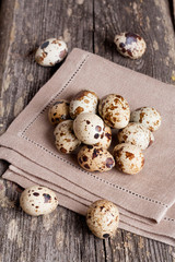 Quail eggs on rustic wooden table