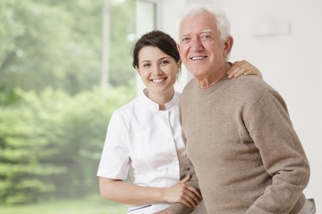 Woman caring for old man
