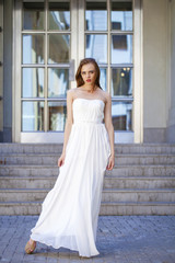 Obraz premium Full length portrait of beautiful model woman with long legs wea