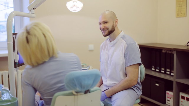 dentist talking to patient