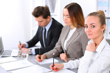 Group of Business people at meeting, focus on blond business woman