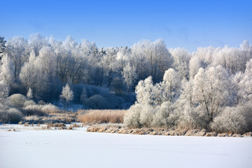Winter landscape with frozen lake