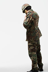 Soldier putting on helmet