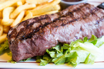 juicy steak beef meat with tomato and french fries