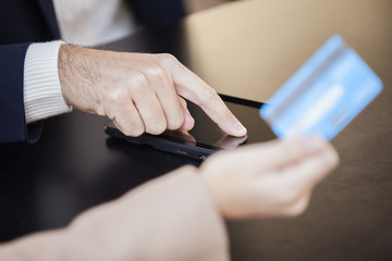 Couple using digital tablet  and credit card to make purchases online