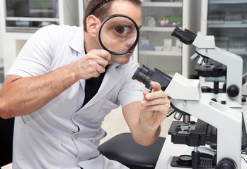 Man working with a microscope in Laboratory