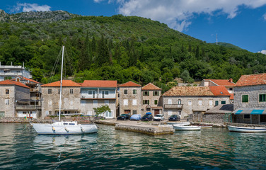 Fototapeta na wymiar Sailing boat in the old mediterranean village