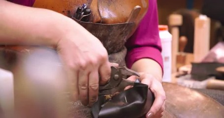 Bespoke Shoemaker Pinning Leather Together To Make Shoe
