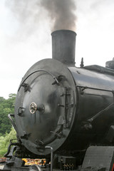 Fototapeta na wymiar Beautiful Black steam locomotive outdoor - vintage steam engine