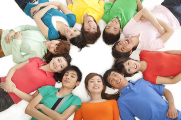 Young people lying in a circle