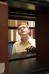 Male student studying in the library