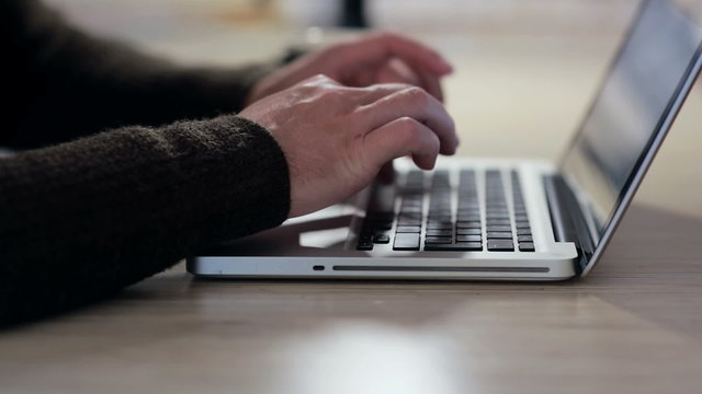 Man hands working on laptop in the workplace