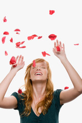 Petals falling on a woman