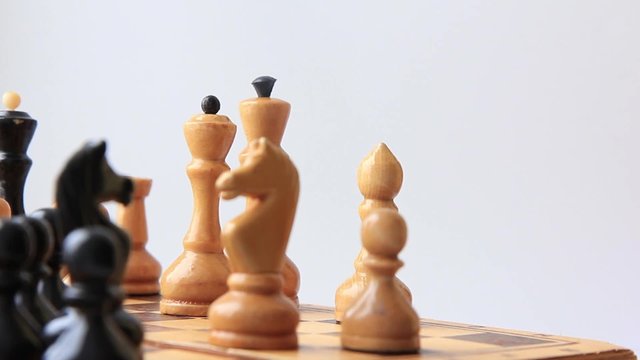 a game of chess on a white background