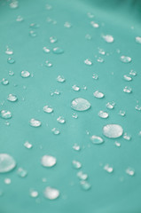 Waterproof coating textile, background with water drops.
