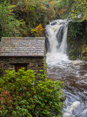 Autumn waterfall following heavy rainfall at Rydal mount, Rydal, Cumbria, UK